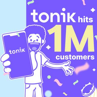 man holding phone showing Tonik reaching 1 million customers 
