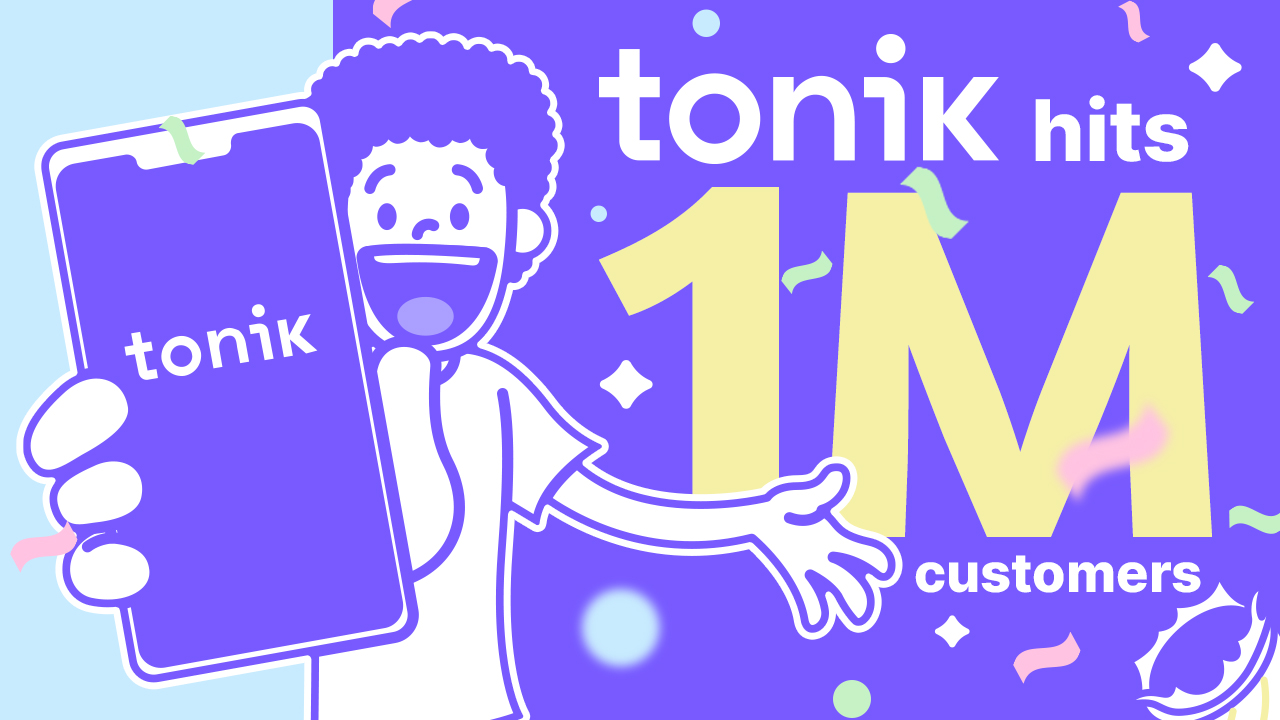 man holding phone showing Tonik reaching 1 million customers 